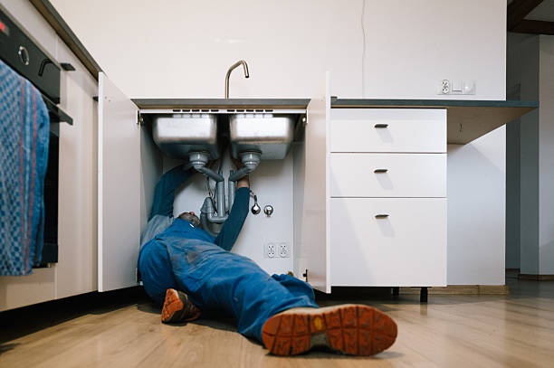Professional Drain Cleaning technician working in Newport, KY
